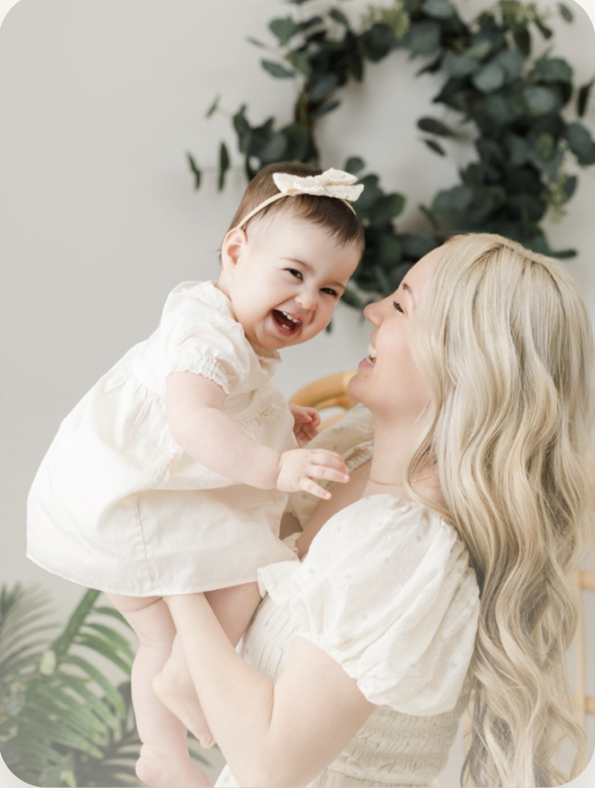 Mother joyfully holding her baby